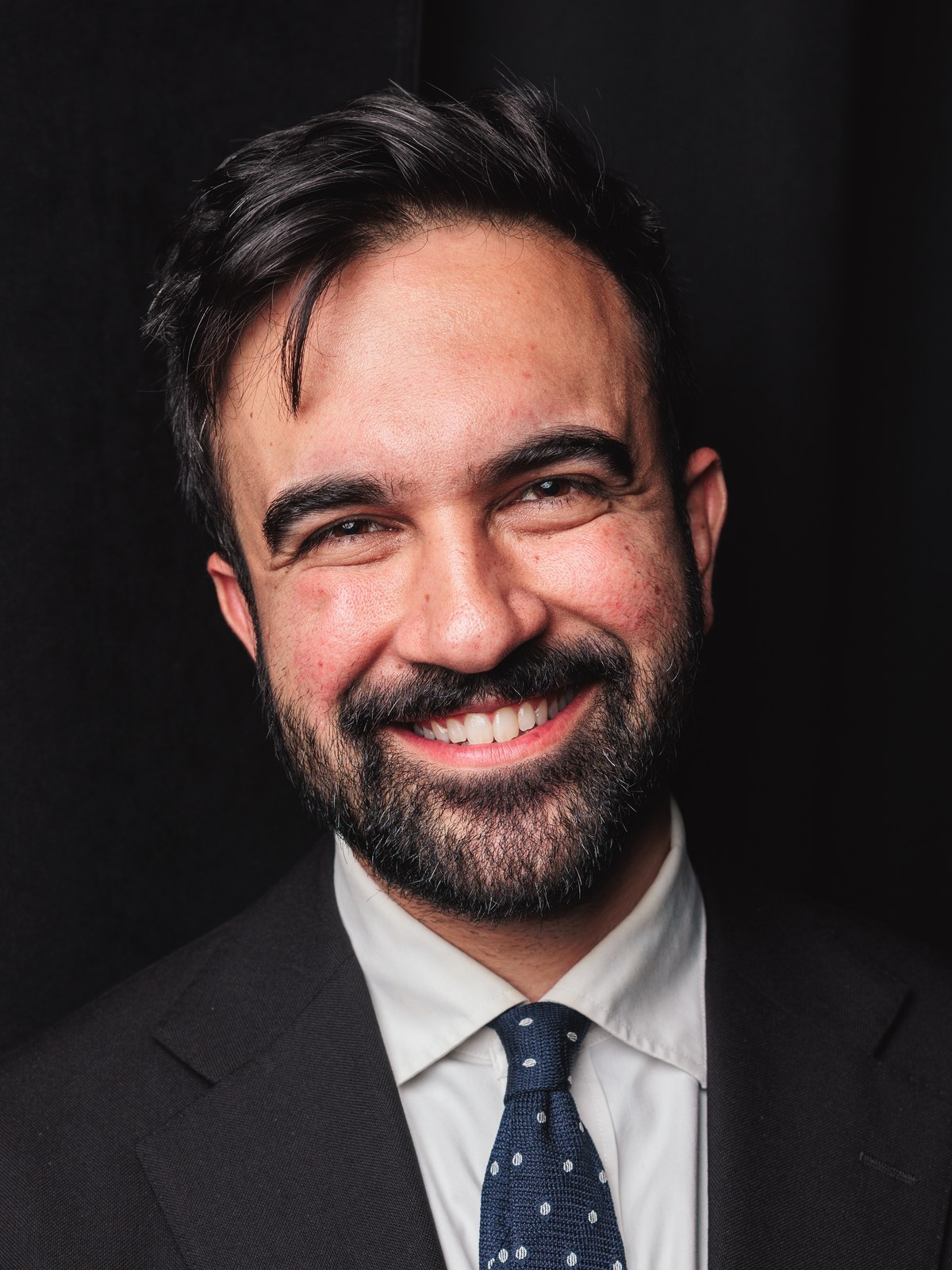 Zohran Mamdani, face-forward portrait, May 2025.